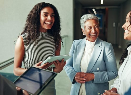 Talking, schedule or business people on tablet in lobby for research, teamwork or accounting proposal. Financial advisor, finance analysts or project agenda for budget report, funding or feedback
